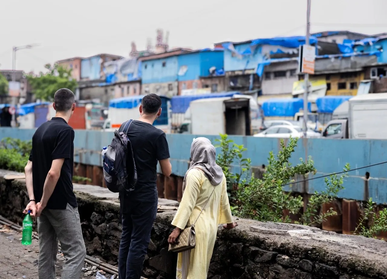 Every Dhobi Ghat tour with us starts in Dharavi — because to understand the laundry, you first need to understand the city that built it. This is where the walk begins.