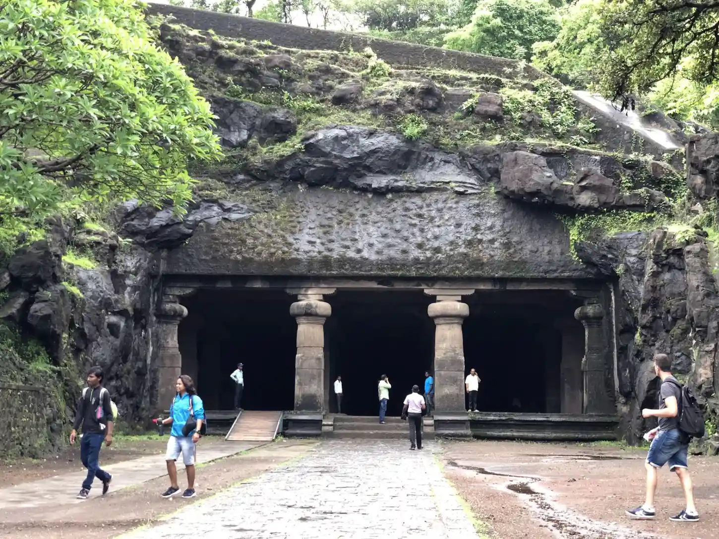 The grand rock-cut entrance of the Elephanta Gufa welcomes visitors on a private Elephanta Caves trip from Mumbai