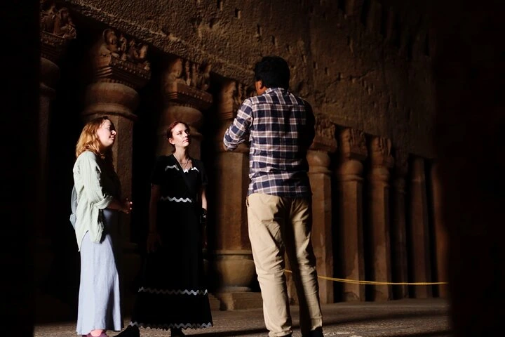 Inside the ancient chaitya hall of Kanheri Caves Mumbai with carved pillars and Buddhist rock-cut architecture