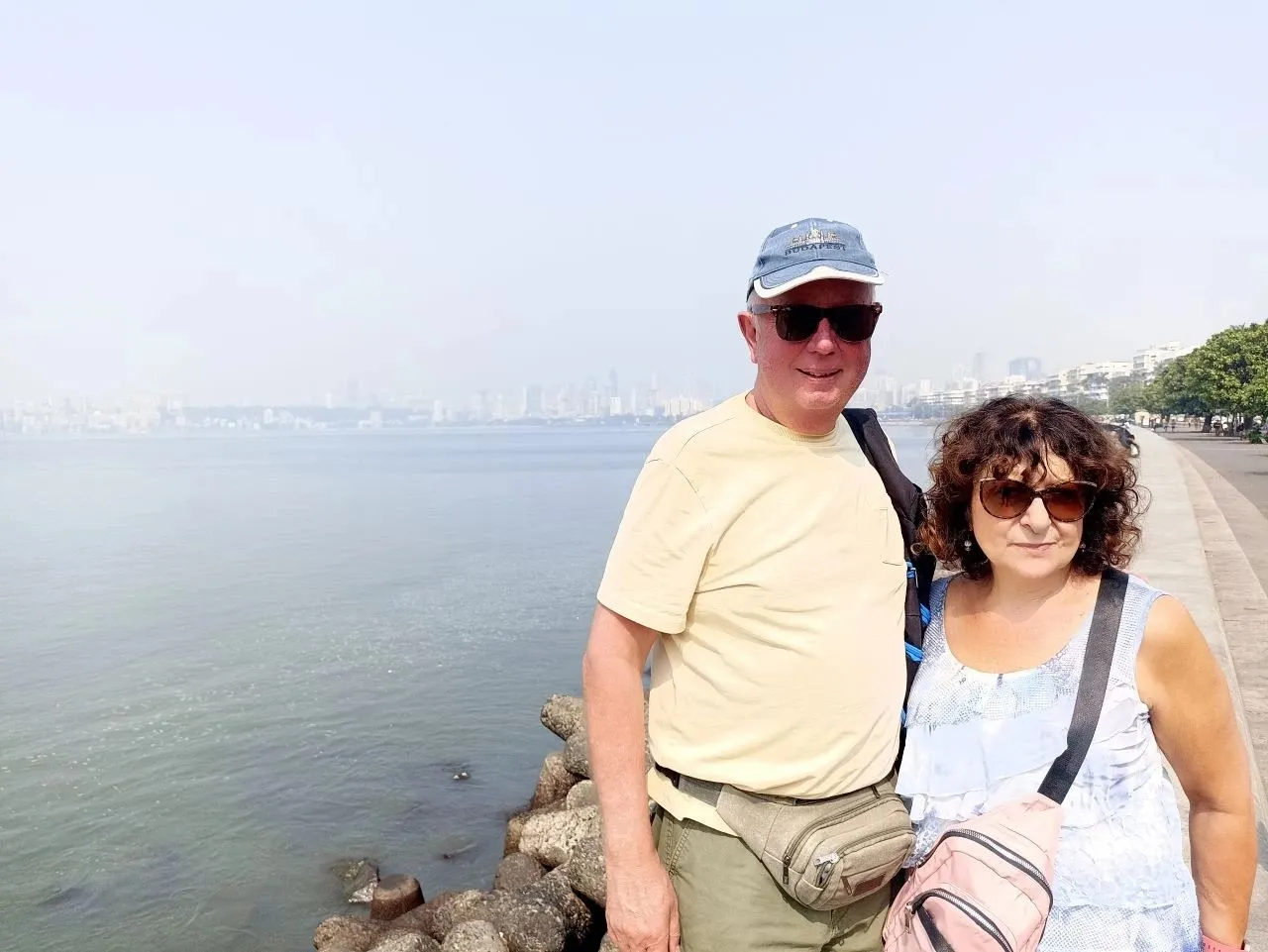 Cruise passengers enjoying a peaceful moment at Marine Drive Mumbai during their private Mumbai Shore Excursion with Cityscape Mumbai Tours