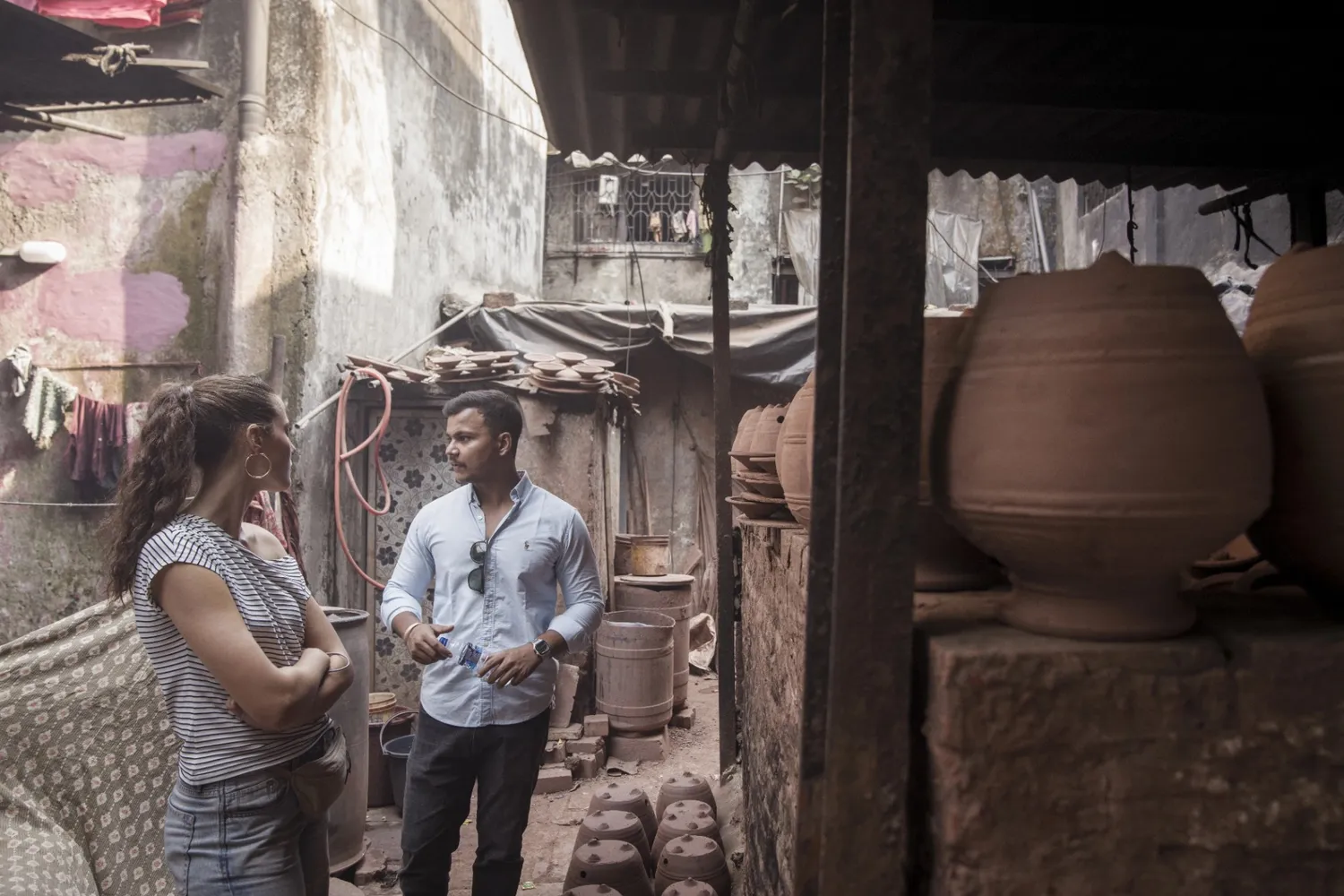 Exploring Dharavi's pottery neighbourhood during our mumbai city tour