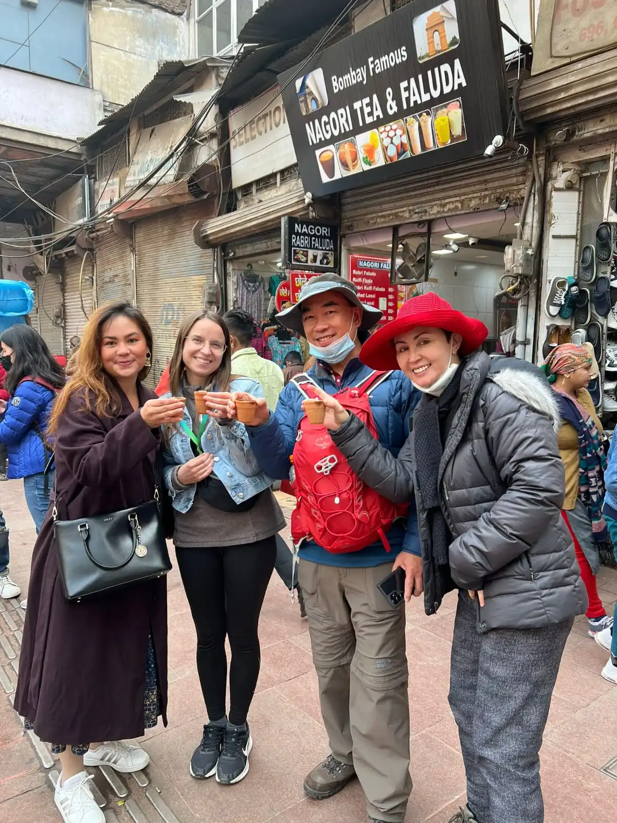 Raising a toast with kulhad cups of tea outside a Chandni Chowk shop during our old delhi street food tour